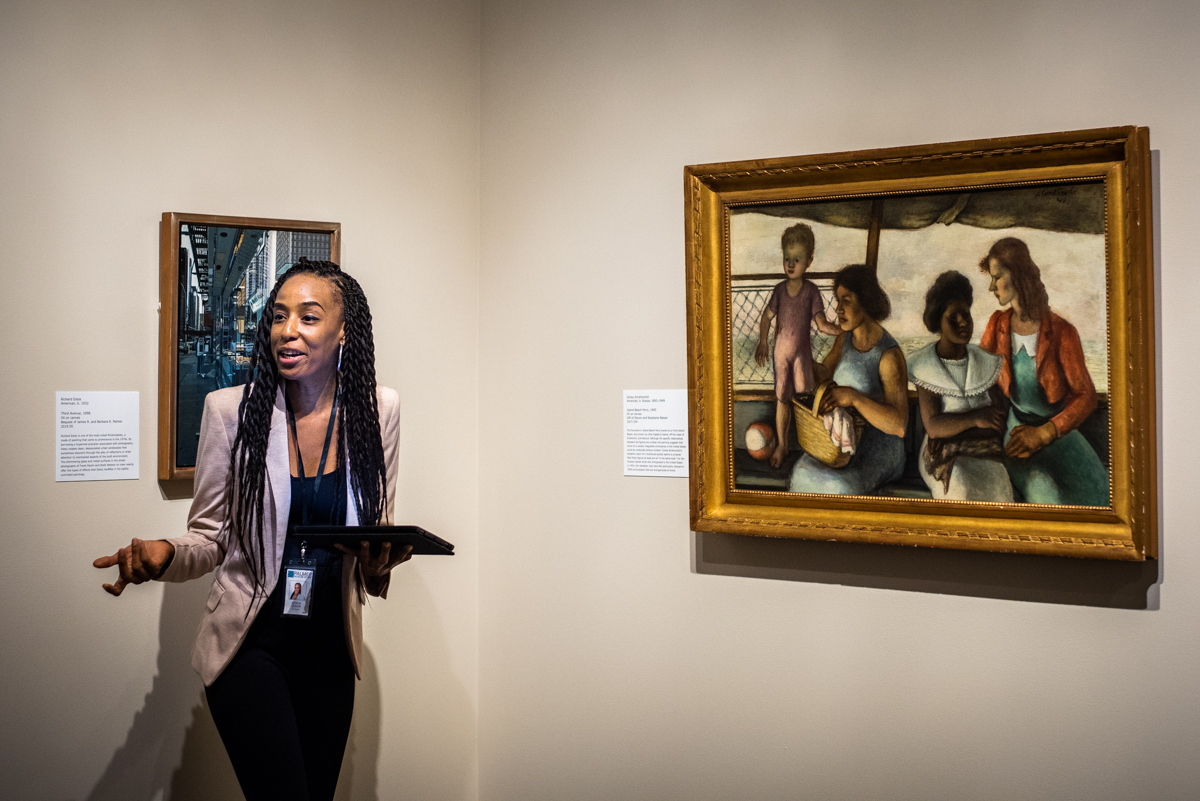 A grad assistant giving a gallery talk at the Palmer